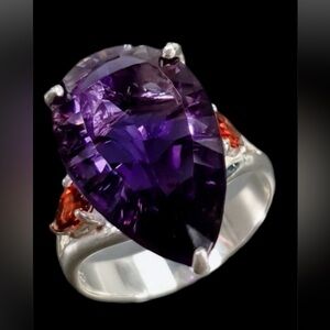 Elegant & sophisticated 12 CTW Genuine Amethyst Ring flanked by Genuine Garnets